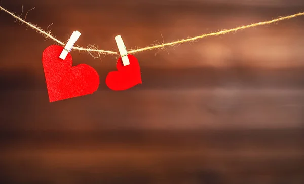 Background Valentine's day. two red hearts on wooden — Stock Photo, Image