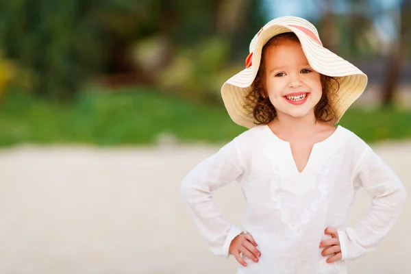 Happy child girl in white dress on beach in summer sea — Stock Photo, Image