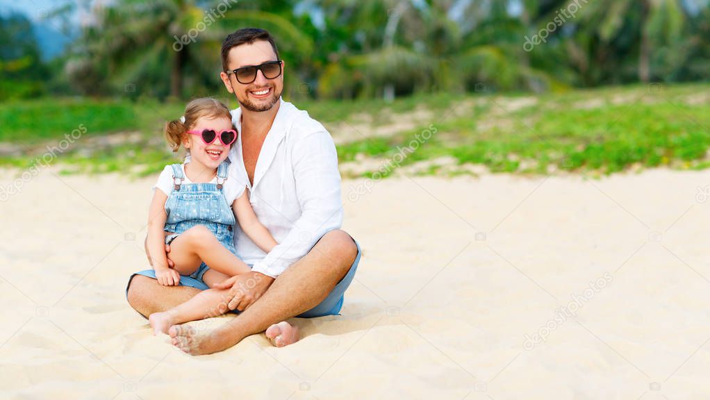 father's day. Dad and child daughter playing together outdoors o