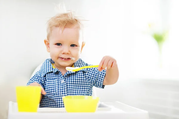 Happy baby eating himsel — Stock Photo, Image