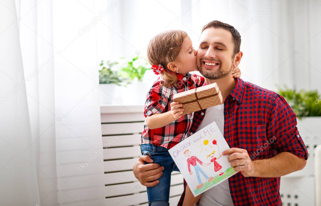 Father's day. Happy family daughter giving dad a greeting card on holida