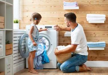 Happy family man father  householder and child daughter in laundry clipart