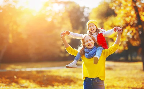 Happy family mother and child daughter on   autumn walk — Stock Photo, Image