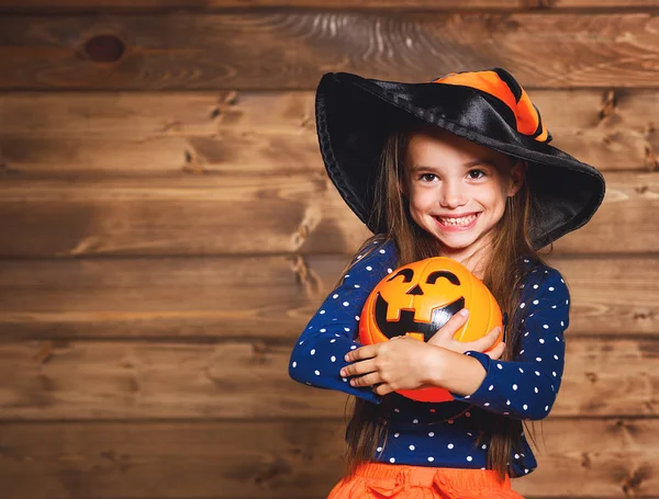 Funny child girl in witch costume in halloween — Stock Photo, Image