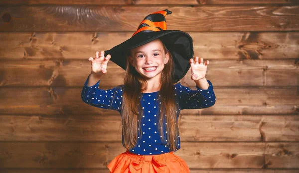 Funny child girl in witch costume in halloween — Stock Photo, Image