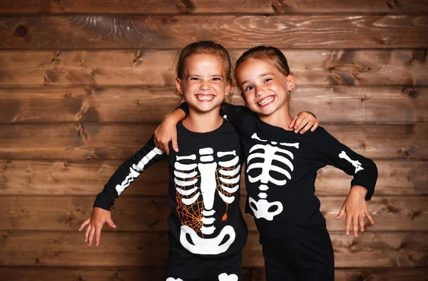 Holiday halloween. funny funny sisters twins children in carniva — Stock Photo, Image