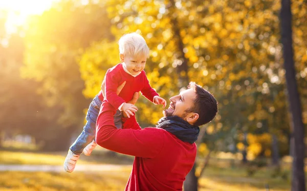 Happy family father and baby son on   autumn walk — Stock Photo, Image