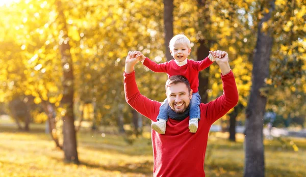 Happy family father and baby son on   autumn walk — Stock Photo, Image