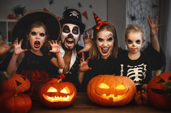 Happy family mother father and children in costumes and makeup o — Stock Photo, Image