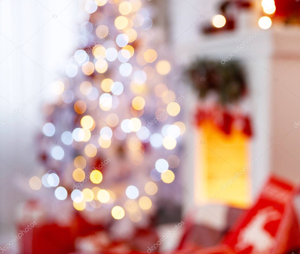 Christmas interior in red and white colors with tree and firepla