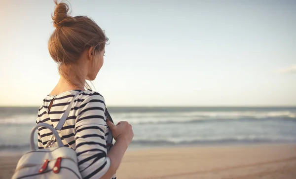 Happy woman enjoying freedom with open hands on sea — Stock Photo, Image