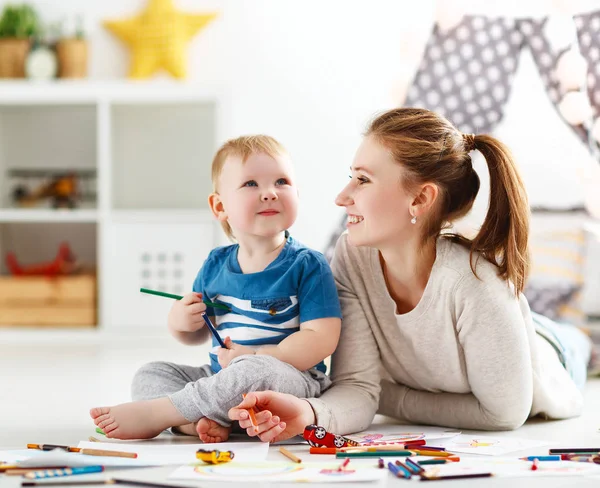 Children creativity. mother and baby son drawing together — Stock Photo, Image
