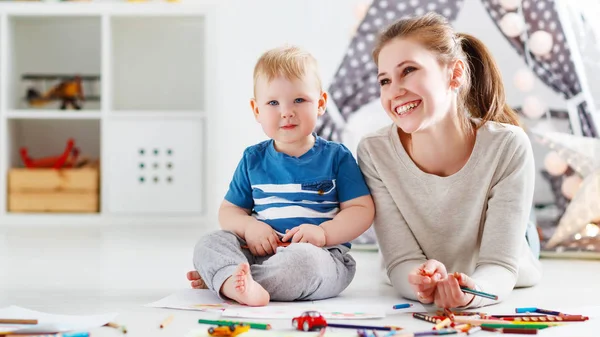 Children creativity. mother and baby son drawing together — Stock Photo, Image