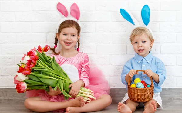 Happy easter! funny funny children   with ears hare getting read
