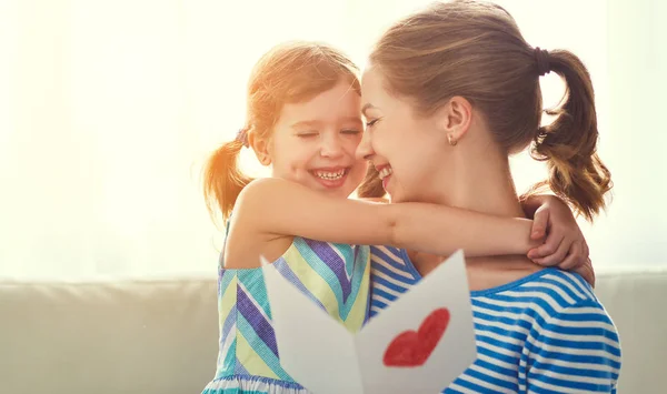 Happy mother's day! Child daughter congratulates moms and gives — Stock Photo, Image