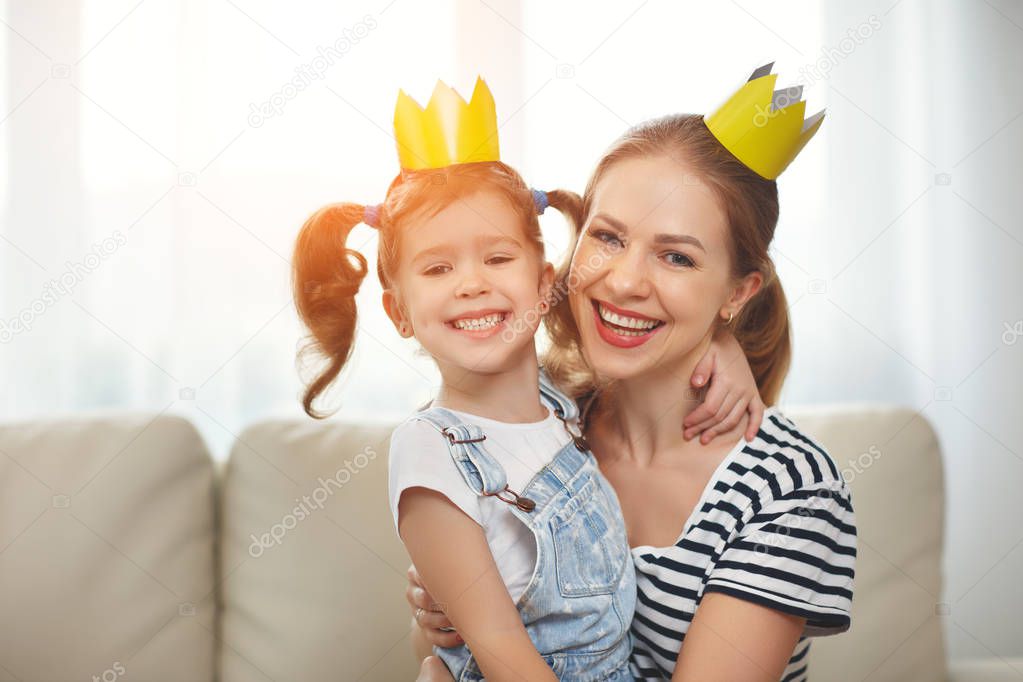 happy mother's day! mother and child daughter in crowns