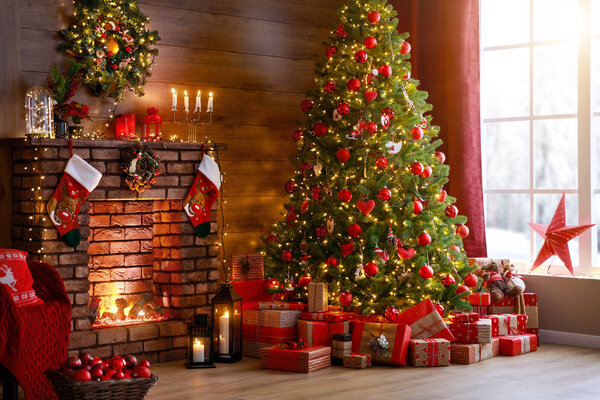 interior christmas. magic glowing tree, fireplace, gifts 
