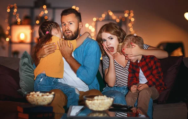 Family mother father and children watching projector, TV, movies — Stock Photo, Image