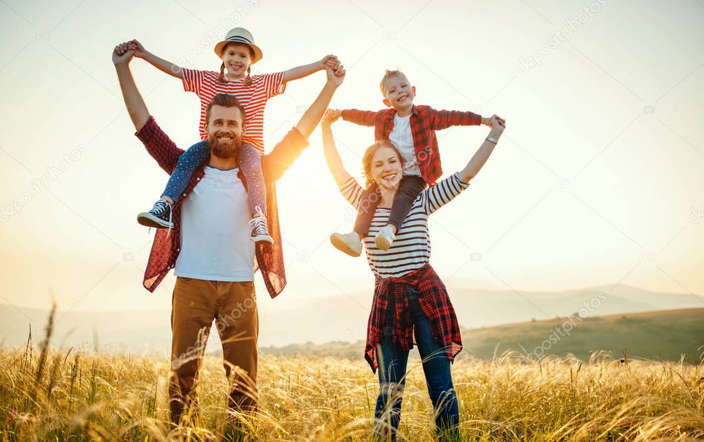 Happy family: mother, father, children son and daughter standing