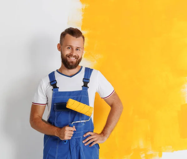 Renovation Apartment Happy Man Worker Overalls Paints Walls Yello — Stock Photo, Image