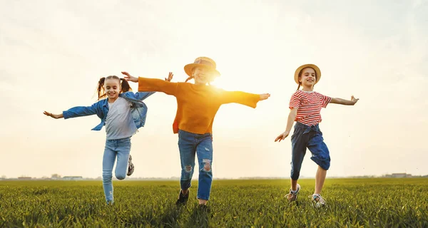 Cheerful Little Girls Casual Clothes Having Fun Running Together Green — Stock Photo, Image