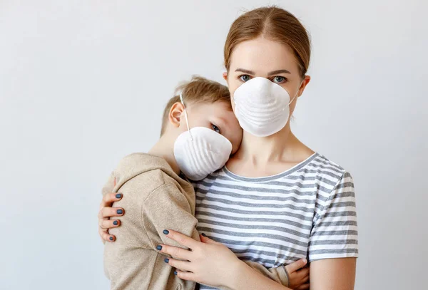 Adult Woman Hugging Little Boy Medical Masks Coronavirus Epidemic Gray — Stock Photo, Image