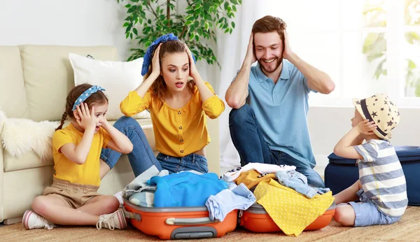 Playful Parents Little Kids Packing Luggage Sitting Floor Covering Ears — Stock Photo, Image