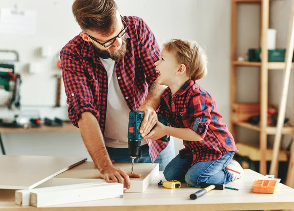 Delighted Little Boy Casual Clothes Laughing Helping Father Drill Hole — Stock Photo, Image