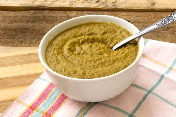 arabic food, brown lentil in white glass bowl