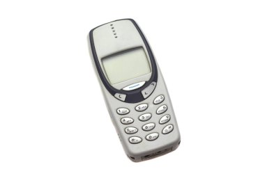Beyaz arka plan üzerinde izole eski gri cep telefonu