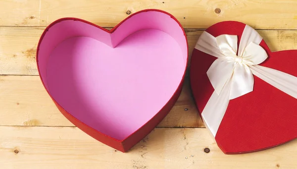 open heart shaped box on wood table