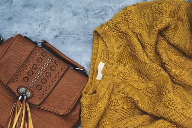 The concept of home comfort, coziness and warmth. bag and sweater