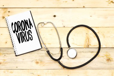 Roman Coronavirus Hastalığı 2019-NCoV dizüstü bilgisayarda, stetoskopta