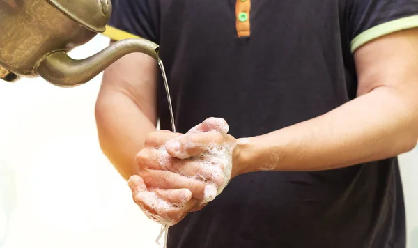 Arabic Man Washing Hands Soap Using Copper Jug Water Corona — Stock Photo, Image