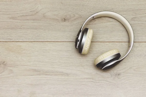 Wireless Bluetooth Headphone Or Earphone  on wood table