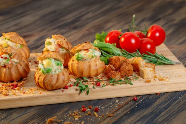 Profiteroles with vegetable filling, tomatoes and herbs — Stock Photo, Image