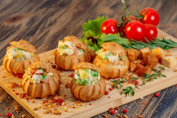 Profiteroles with vegetable filling, tomatoes and herbs — Stock Photo, Image