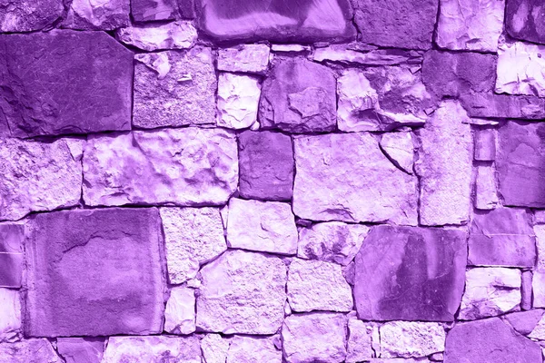 violet wall of large stones