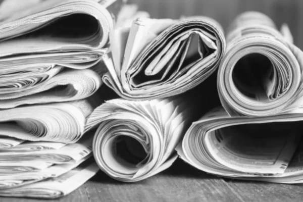 News newspapers stacked and folded, toning