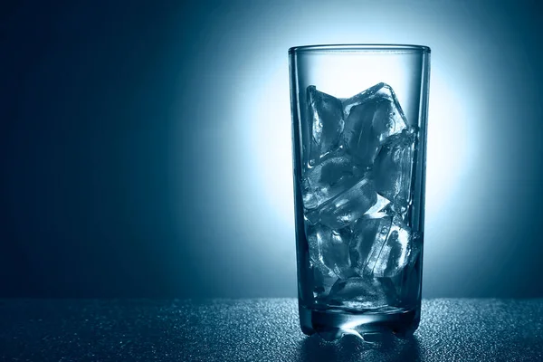 Glass Of Pure Mineral Water With Ice On A Blue Background Studio Thirst Stock Photo