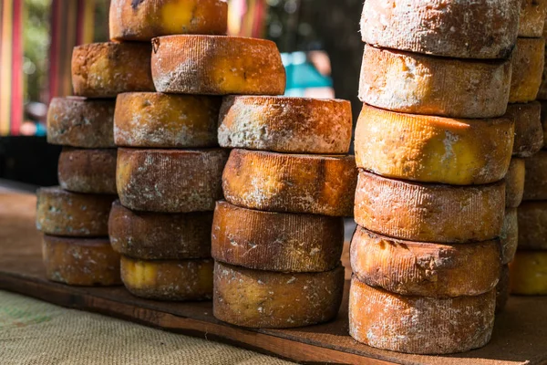 Selection of traditional Italian cheeses on a display, selective focus. — Stock Photo, Image