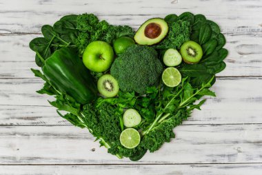 Selection of healthy green food fresh vegetables and fruit.