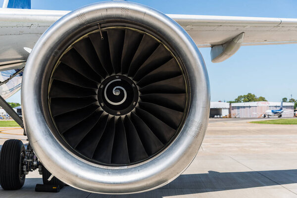 Engine and a wing of an aircraft plane. Airline and travelling concept.