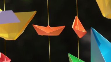 Kağıt tekne gergin ipler üzerinde