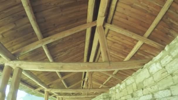 Wooden carport on castle wall — Stock Video