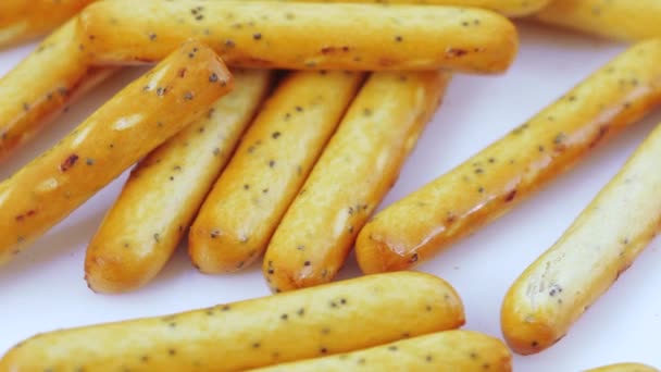 Biscuit sticks with poppy seeds — Stock Video