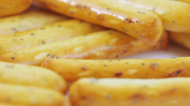 Biscuit sticks with poppy seeds — Stock Video
