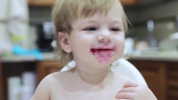 Boy eats cooked beets — Stockvideo