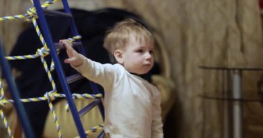One year old boy on the gymnastic