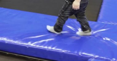 Child boy on a trampoline